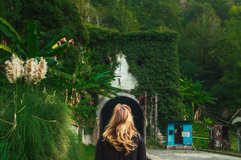 The picturesque abandoned Psyrtskha railway station in autumn in Abkhazia near New Athos.