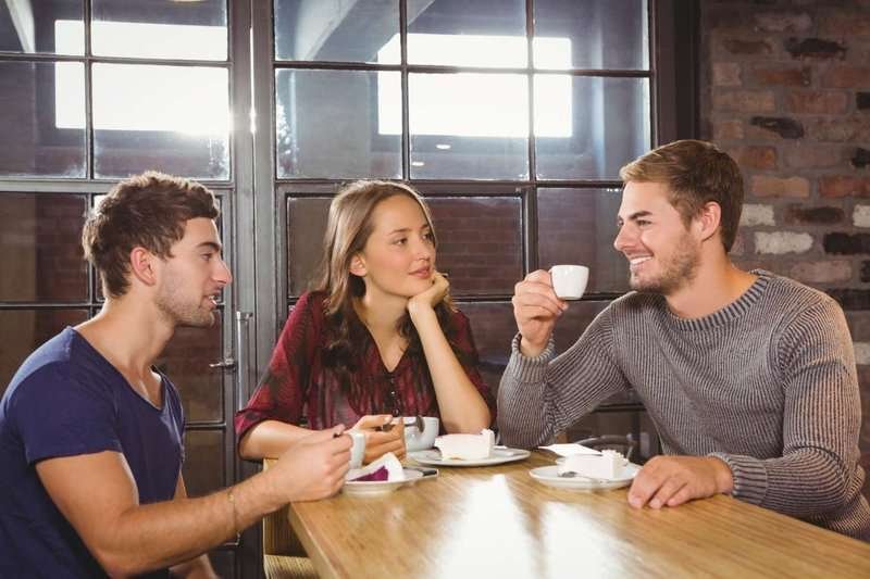 smiling-friends-talking-and-enjoying-coffee-.max-800x600
