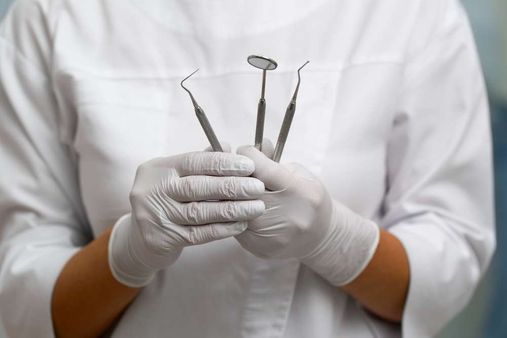 Dentist with a set of instruments