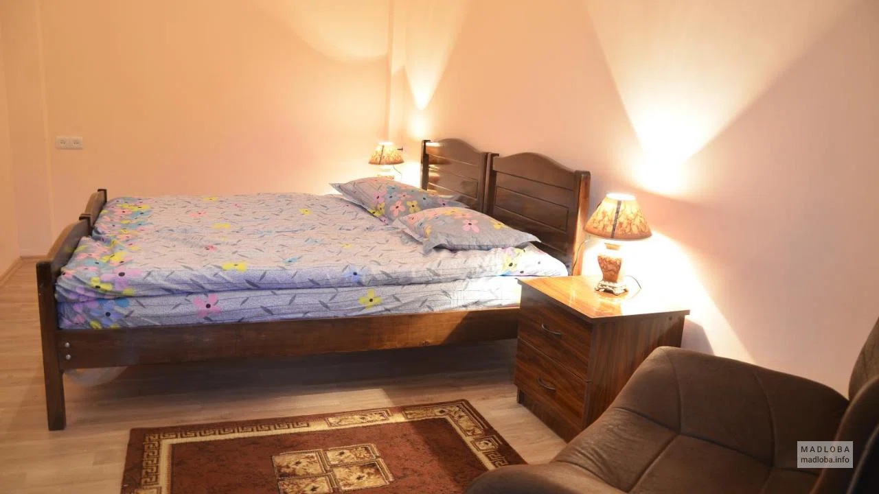 Кровать в номере Tbilisi Apartment в Грузии