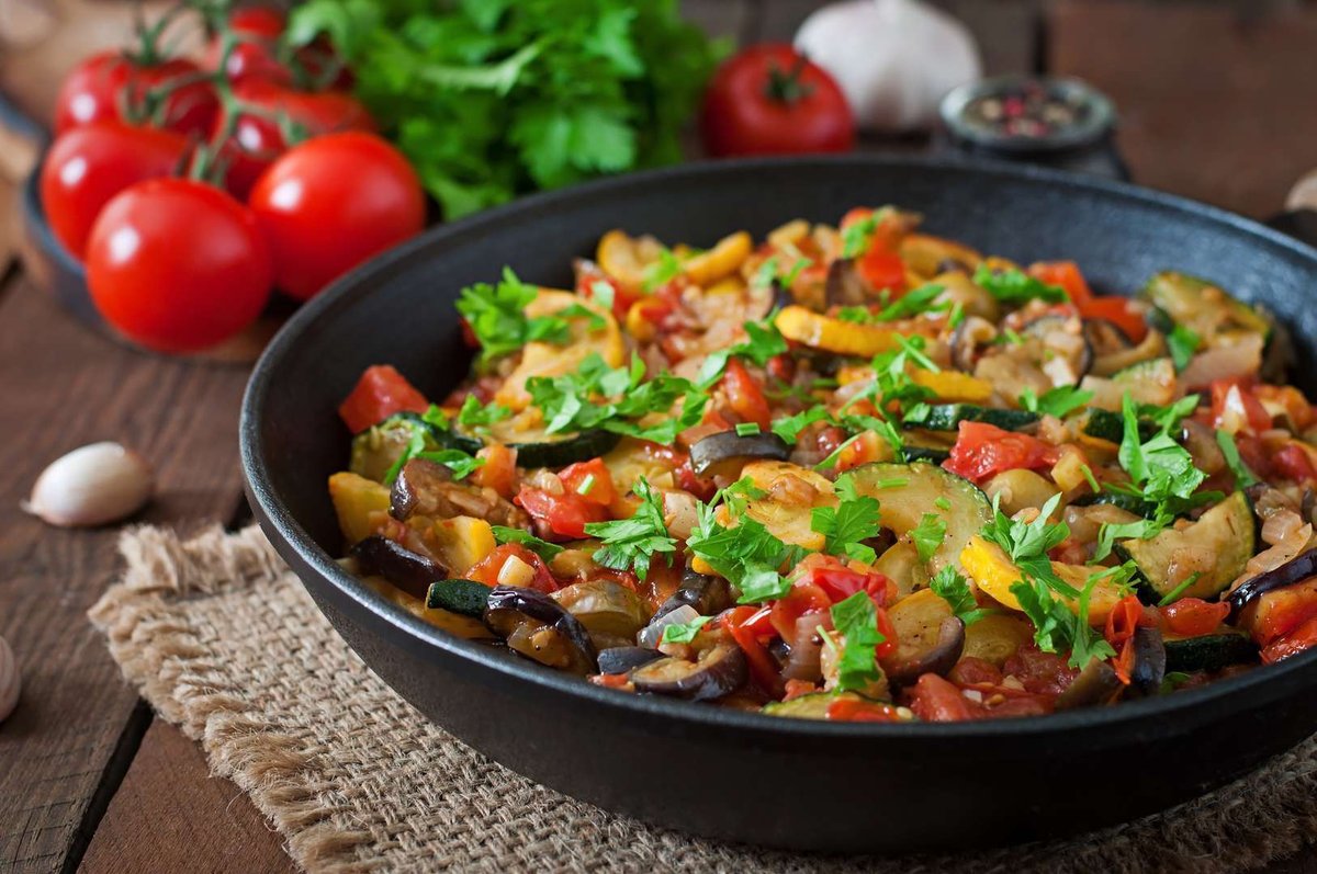 vegetable-ratatouille-frying-pan-wooden-table