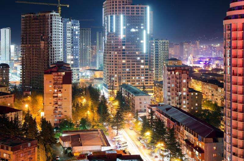 Night view of streets and residential buildings in Batumi