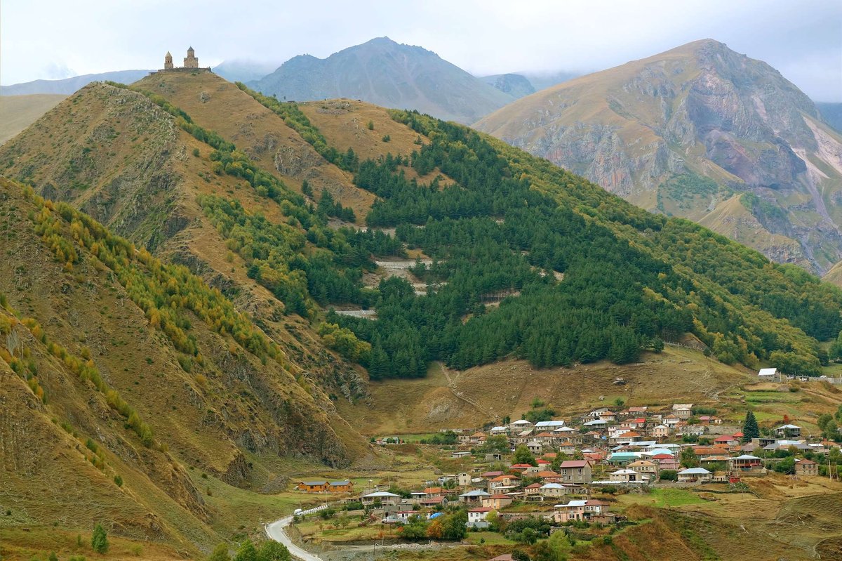village-stepantsminda-with-curvy-road-up-gerget