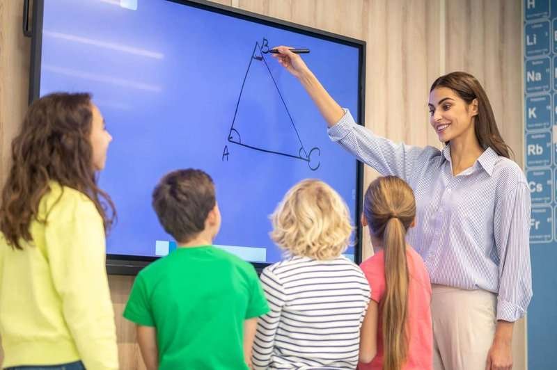 woman-drawing-showing-triangle-on-blackboard.max-800x600