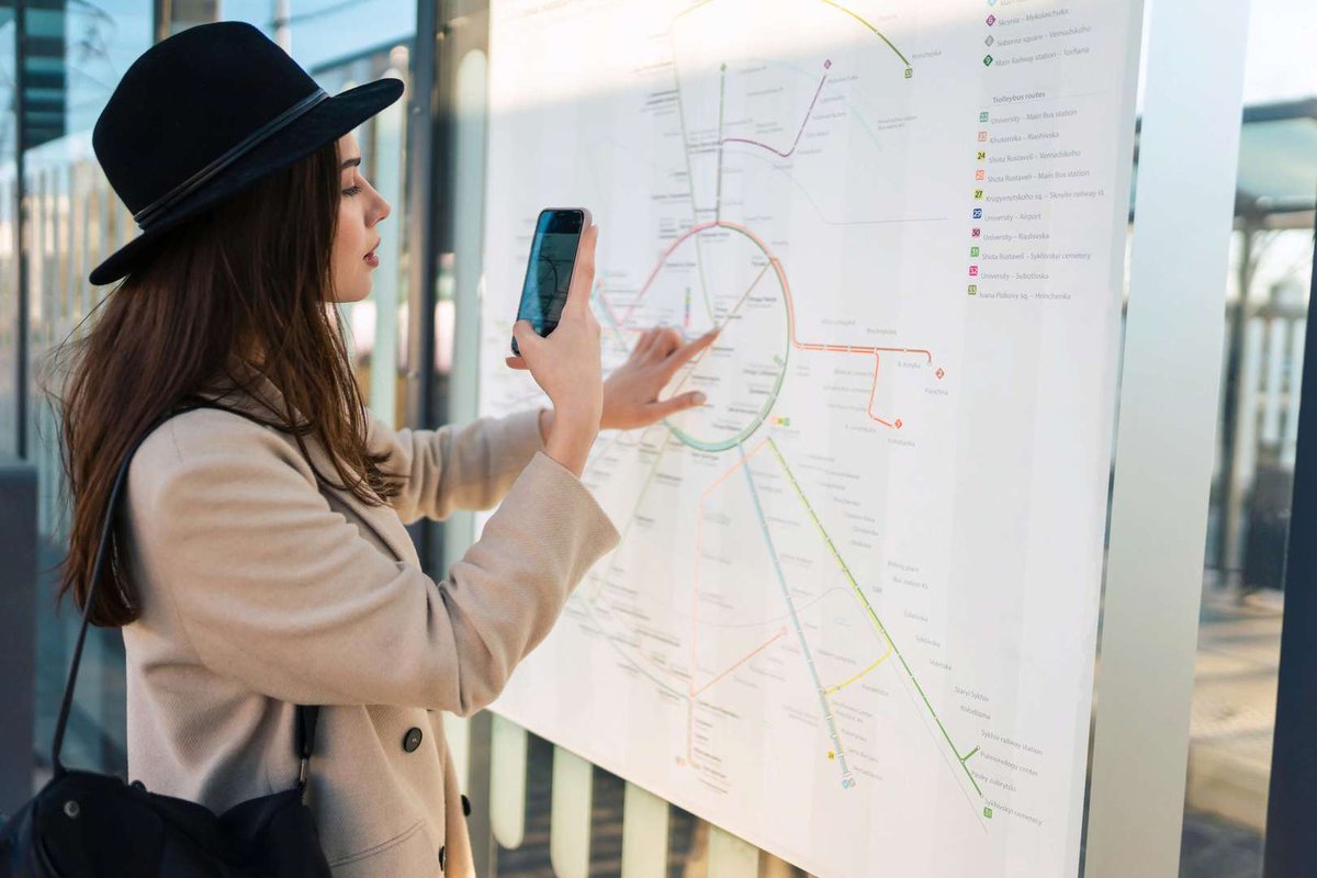 woman-takes-photo-of-map-public-transport-routes.jpg