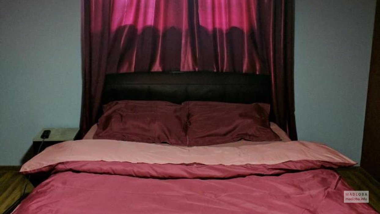 Кровать в номере хостела Your в Грузии